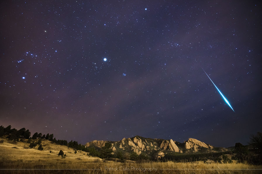 Flatirons of Boulder and a large meteor during the Geminid Meteor Shower.