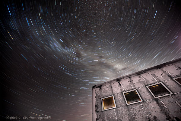The Amundsen-Scott South Pole Station and stars swirl in a 15 minute exposure at night.