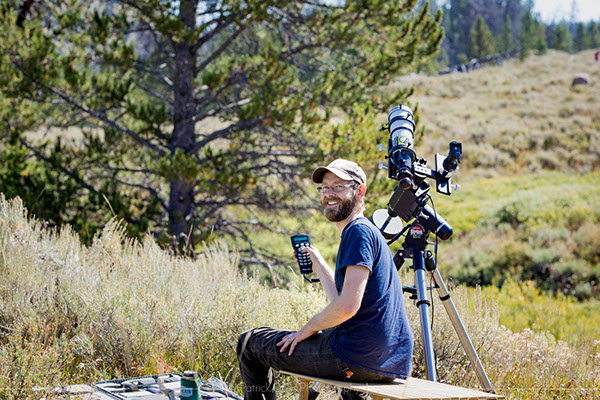 Prepping telescope and cameras for capturing the corona during the solar eclipse.