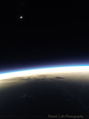 Total solar eclipse and the shadow the moon cast on the surface of Earth from 72,000 feet on a high altitude balloon.